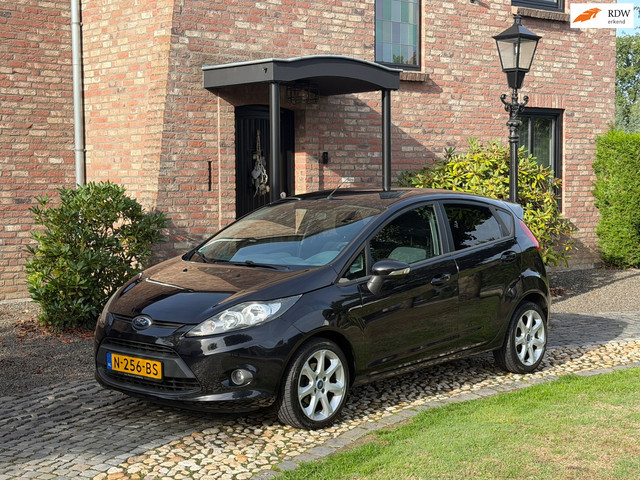 Foto 11 van Ford Fiesta 1.25 Titanium Airco PDC 5-drs Zwart