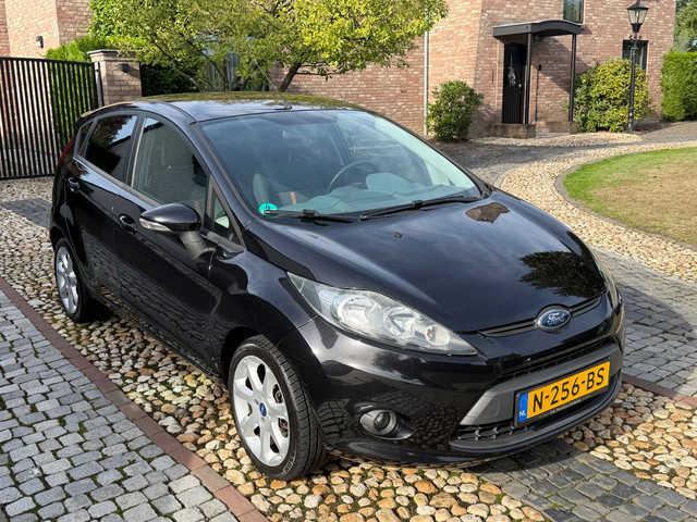 Foto 4 van Ford Fiesta 1.25 Titanium Airco PDC 5-drs Zwart