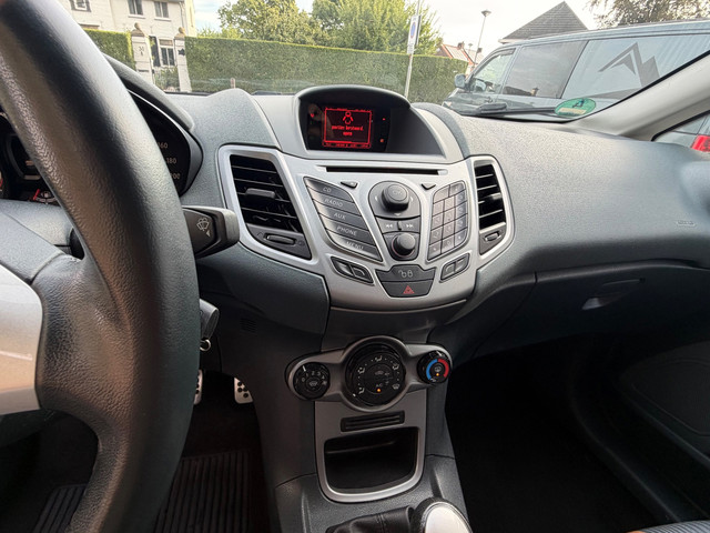 Foto 8 van Ford Fiesta 1.25 Titanium Airco PDC 5-drs Zwart