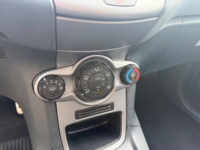 Foto 9 van Ford Fiesta 1.25 Titanium Airco PDC 5-drs Zwart