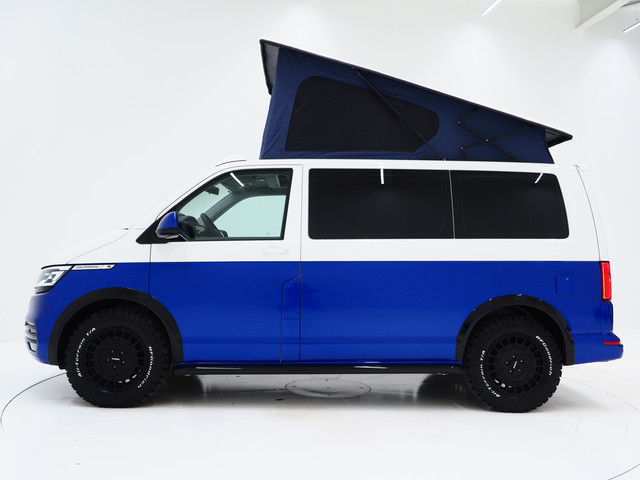 Foto 4 van Volkswagen California 2.0 TDI T6.1 4Motion DSG All Terrain | Slaaphefdak | Draaistoelen | Koelkast |